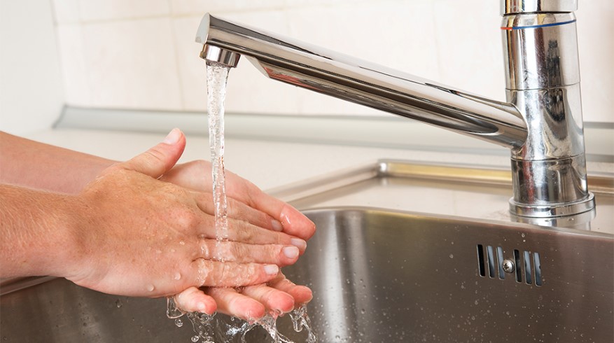 9370596-woman-washing-hands-under-a-tap-water