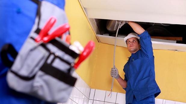 4175162-two-electrician-working-on-ceiling-electrics