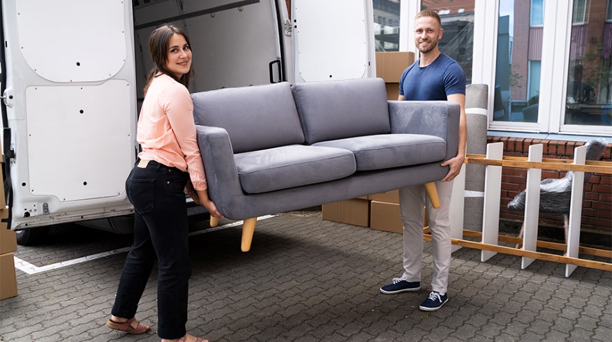 41097595-couple-moving-couch-or-sofa-together