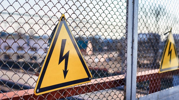31142675-electrical-hazard-sign-lightning-on-yellow-background